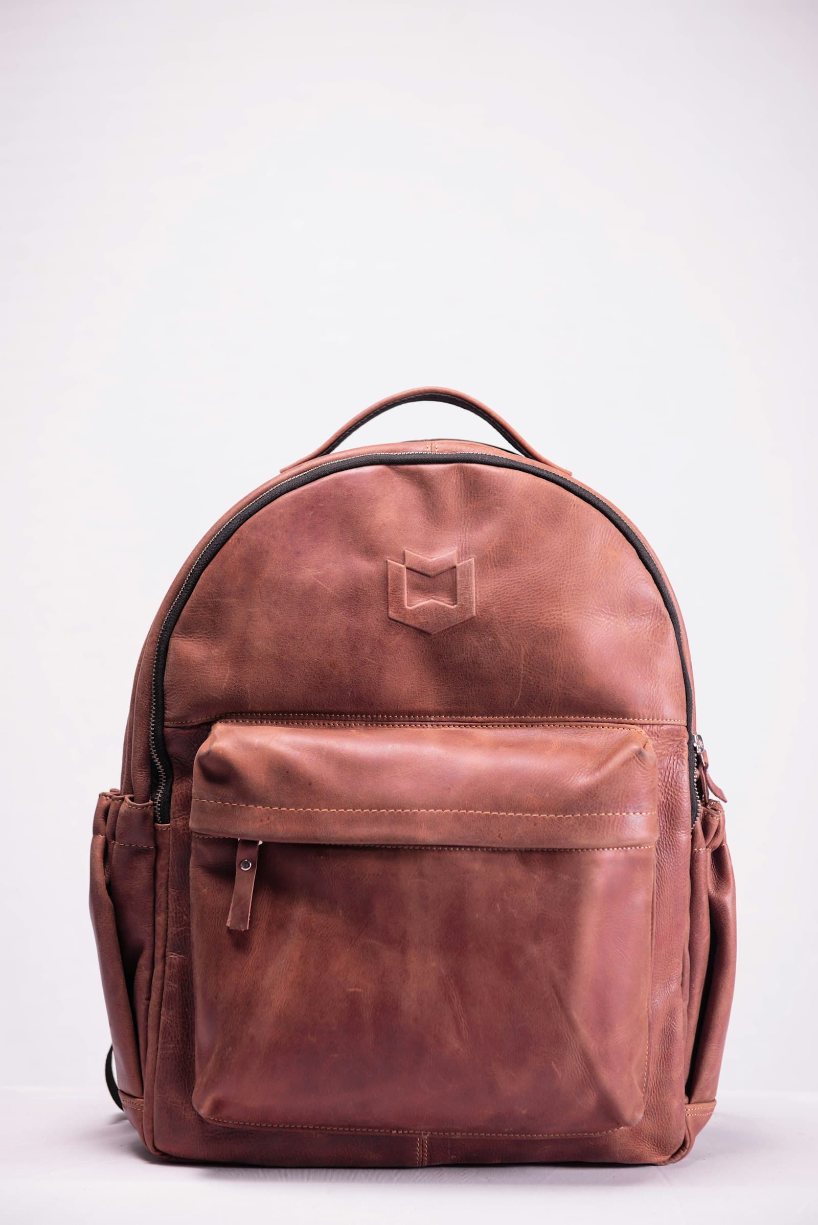 Bellroy Transit Workpack: brown leather backpack on white surface
