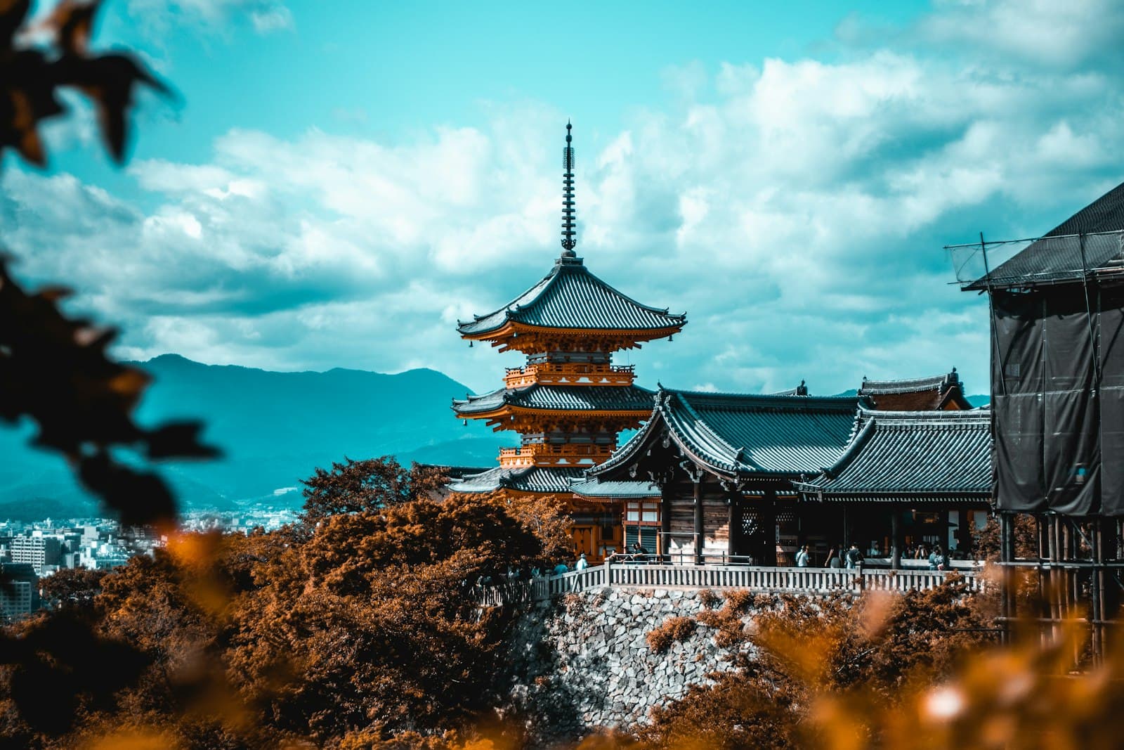 Ten days in Kyoto: people near pagoda under white and blue sky
